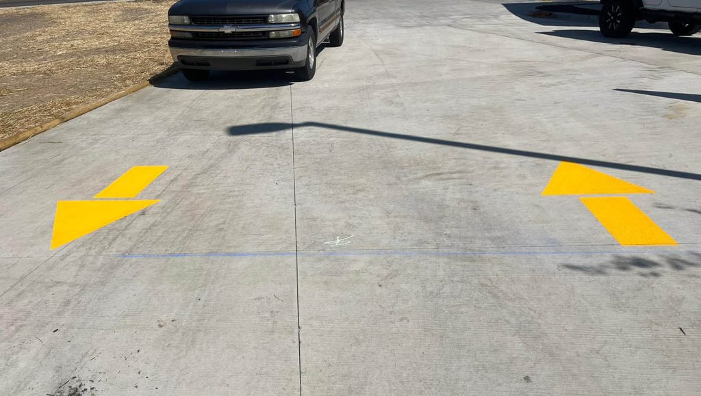 freshly painted parking spots for Take 5 Oil Change parking lot