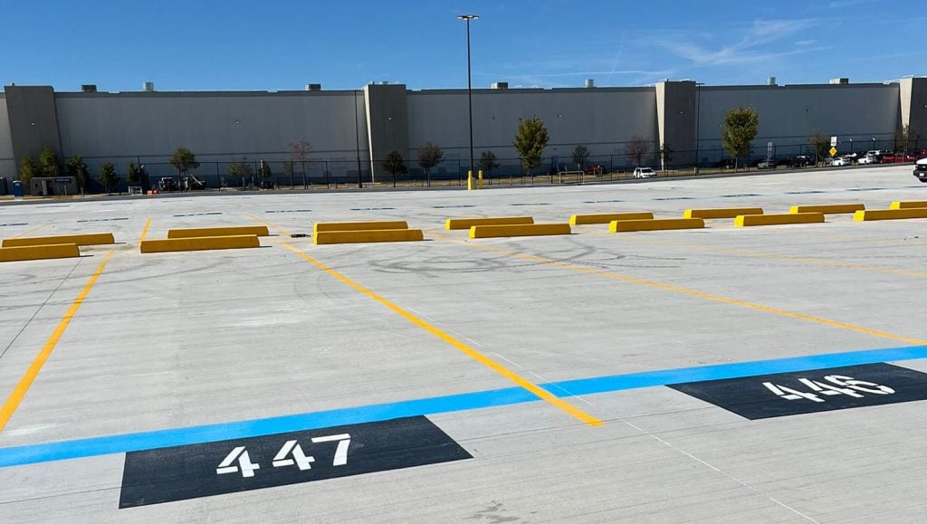 freshly painted line markings and parking stops installed for Amazon