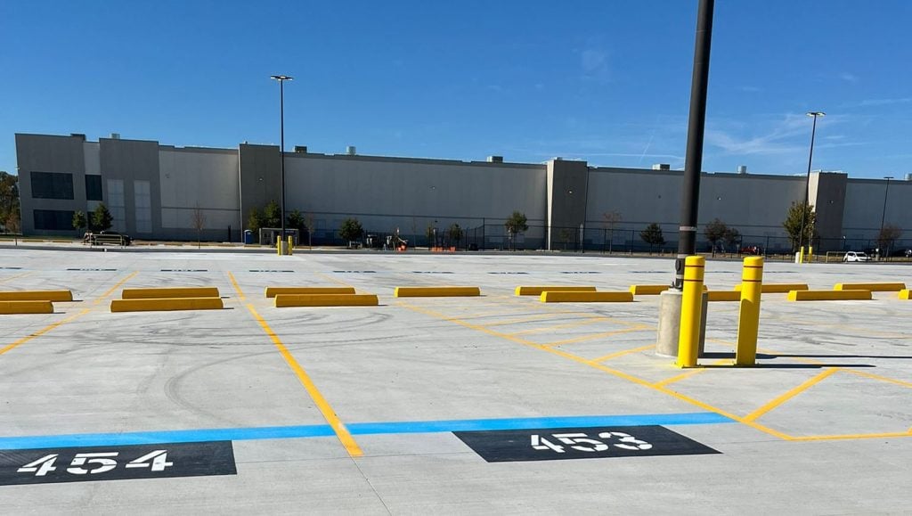 freshly painted line markings for Amazon parking spots