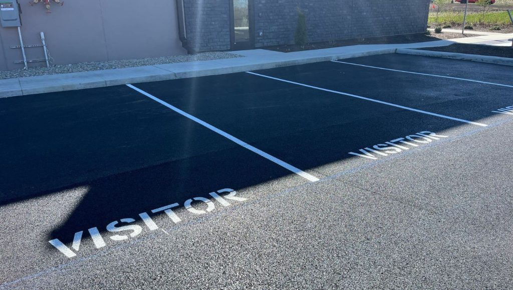 vistor parking spots freshly painted for Burns & Scalo parking lot