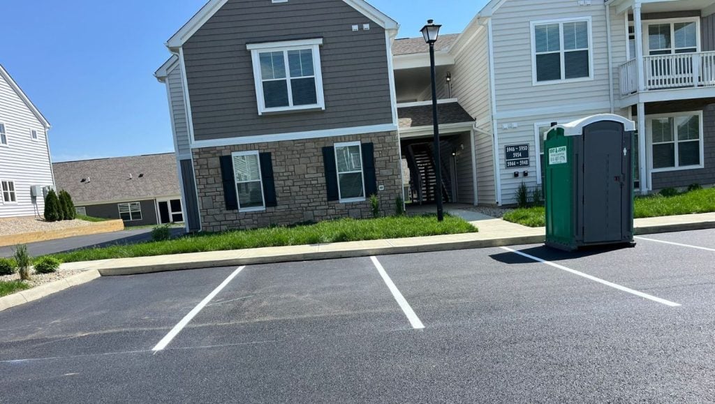 front view of parking spots freshly painted for Orange Summit Apartments