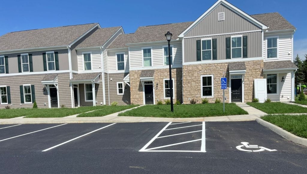close-up front view of Orange Summit Apartments parking lot