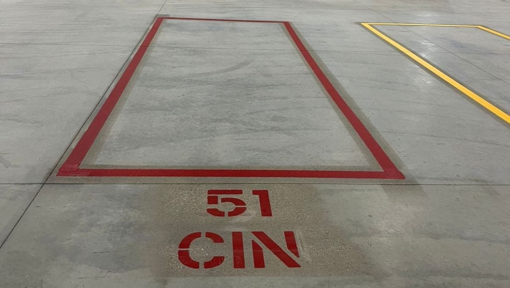 red line striping freshly painted for NEFCO Columbus warehouse