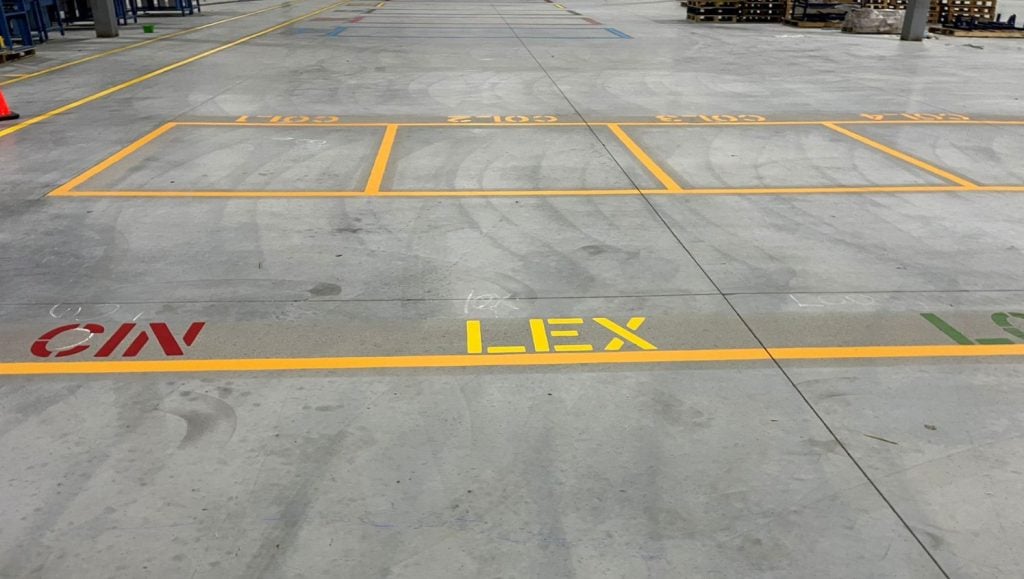 close-up of yellow line markings for NEFCO Columbus warehouse