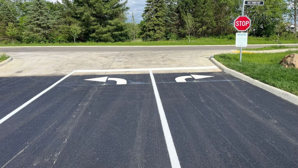 arrows freshly painted for Apartment Complex parking lot