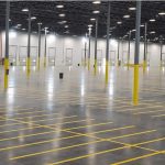 empty warehouse with yellow floor markings