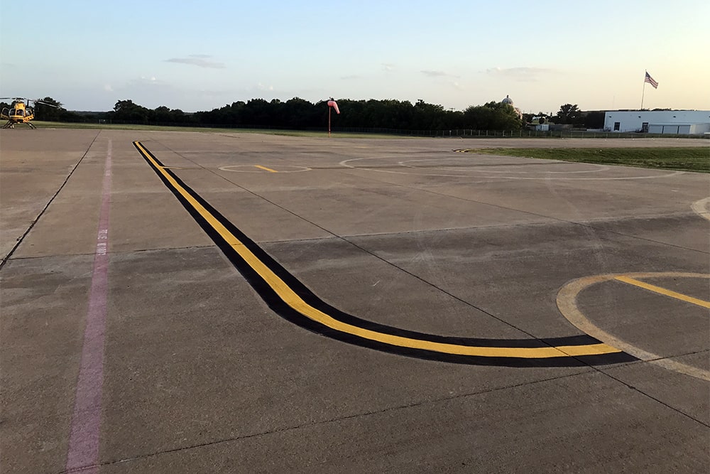 freshly striped taxiway at Desoto Heliport