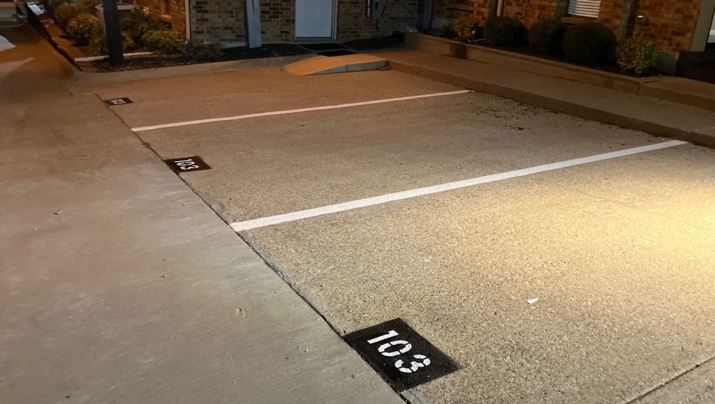 freshly painted parking spots with numbers for Global Advance parking lot