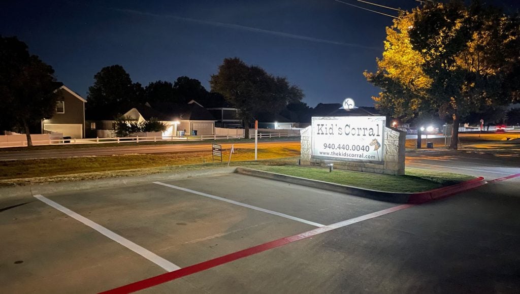 close-up of freshly painted parking spots for The Kid's Corral parking lot