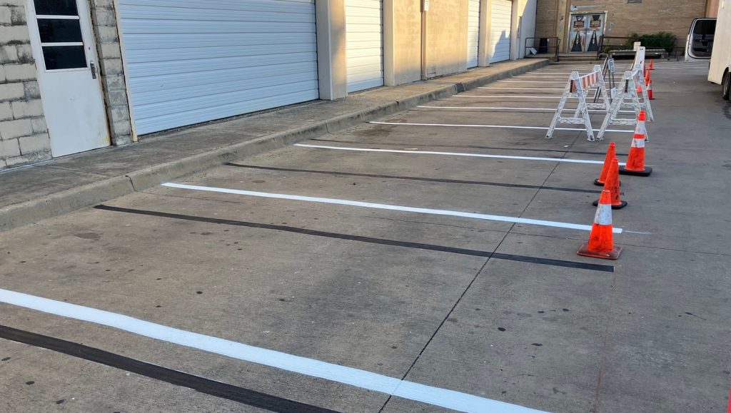 Poor Davids Pub parking lot freshly painted parking spots