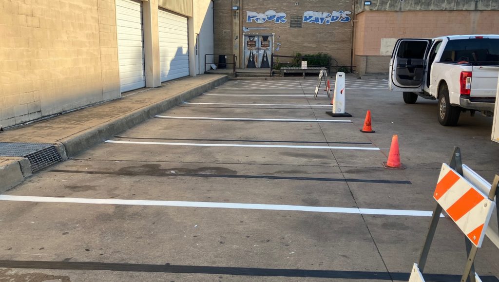 freshly painted arrow on Poor Davids Pub parking lot