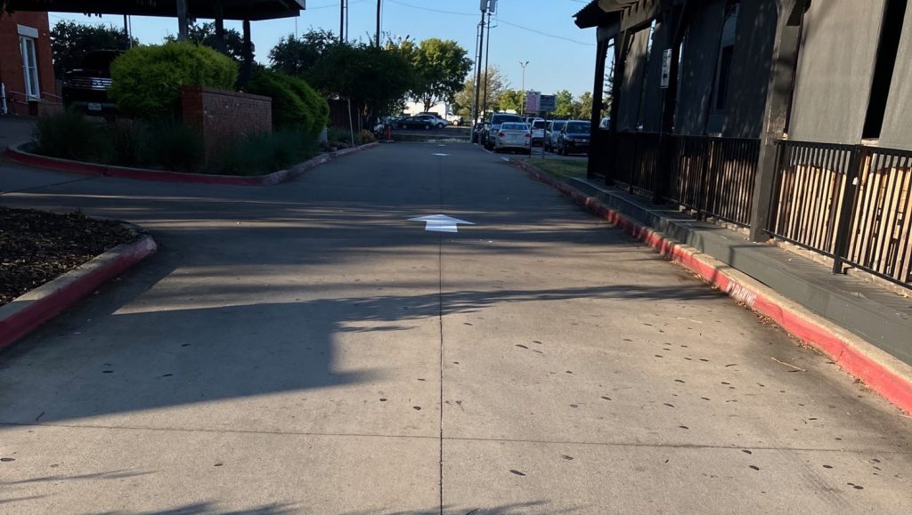 multiple freshly painted arrows for Poor Davids Pub parking lot
