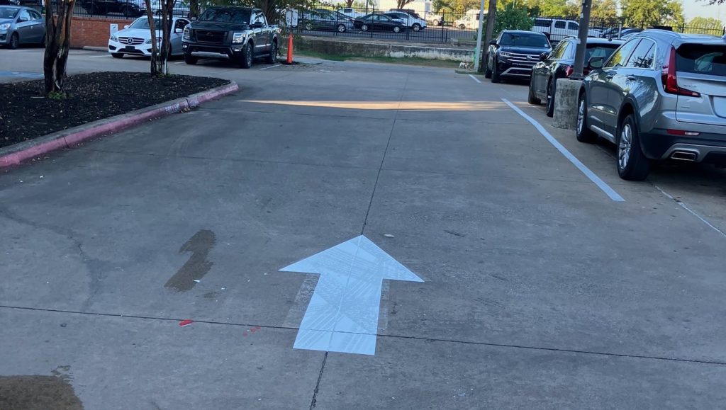 freshly painted arrow for Poor Davids Pub