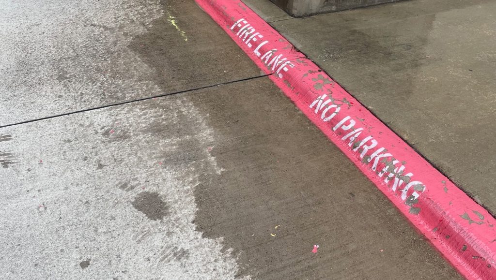 close-up of fire lane striping for The Shops at Legacy West parking lot
