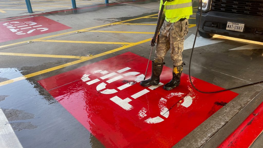 fire lane freshly painted for The Shops at Legacy West parking lot