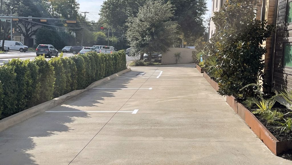 newly installed wheel stops at a dallas homeowner’s association