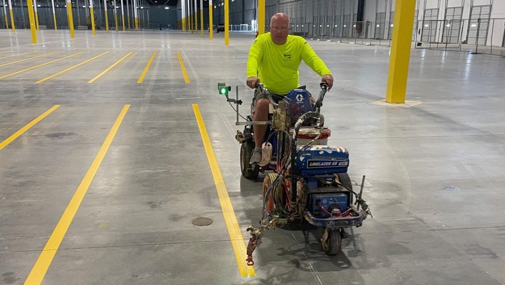 close-up of G-FORCE® employee line marking for DHL Warehouse