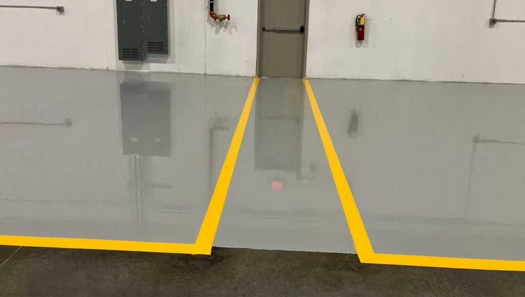 close-up of freshly painted line markings for DHL warehouse