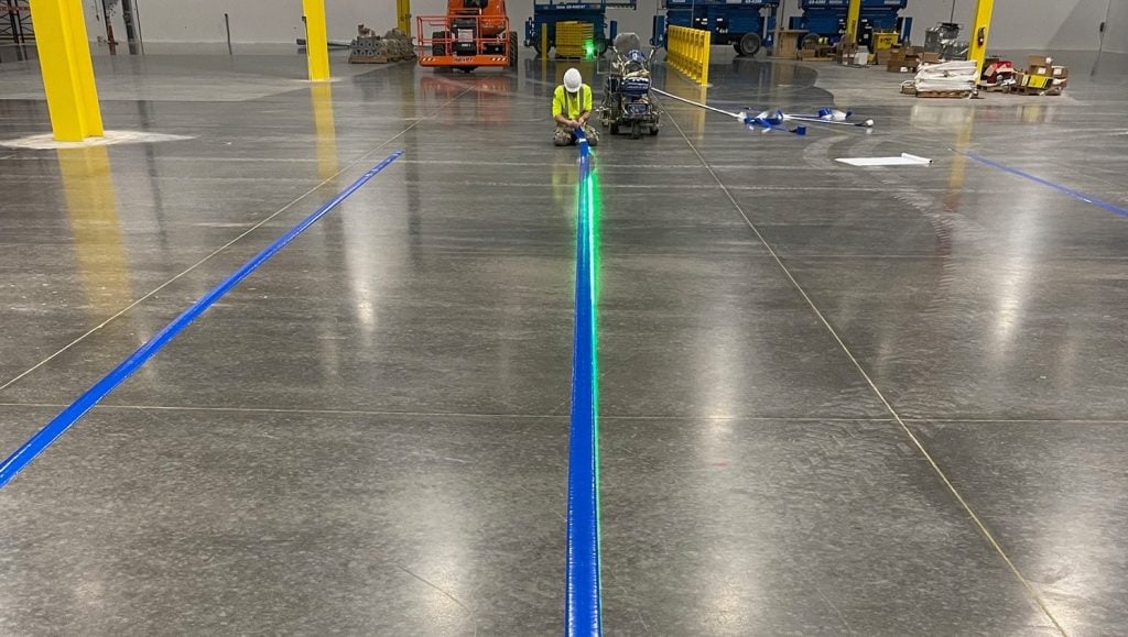 G-FORCE® employee installing new line markings for Pratt & Whitney
