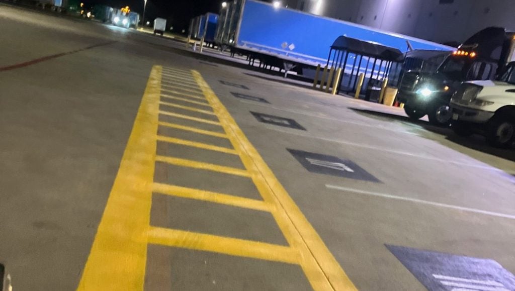 close-up of freshly painted line markings for Amazon