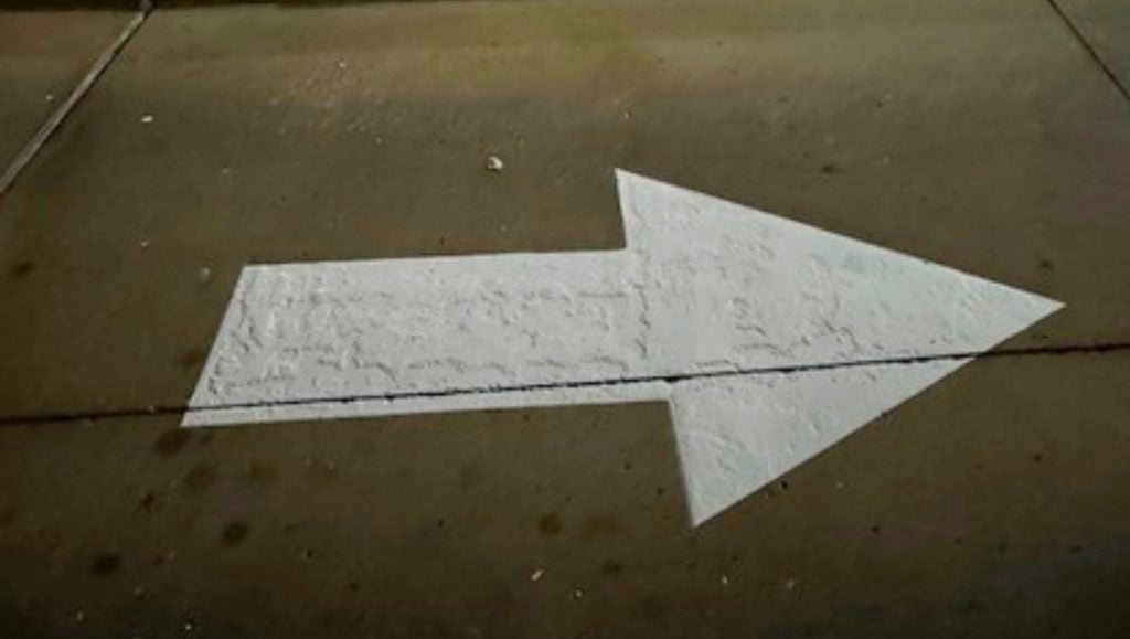 white arrow freshly painted for IN-N-OUT Burger parking lot
