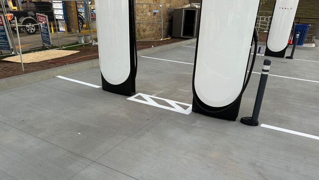 close-up of ev charging bay markings freshly painted for Fuel City parking lot
