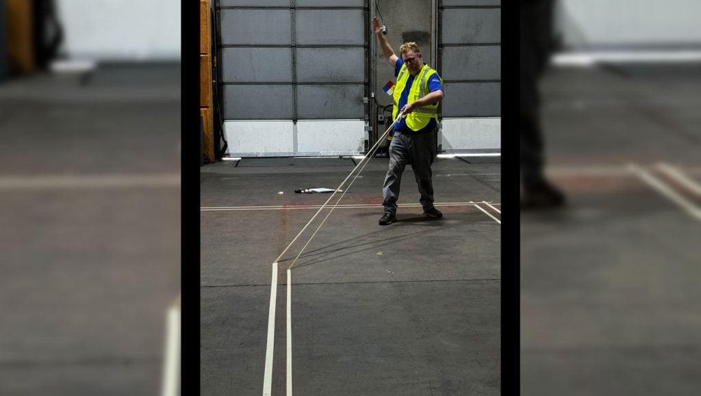 G-FORCE employee marking a warehouse