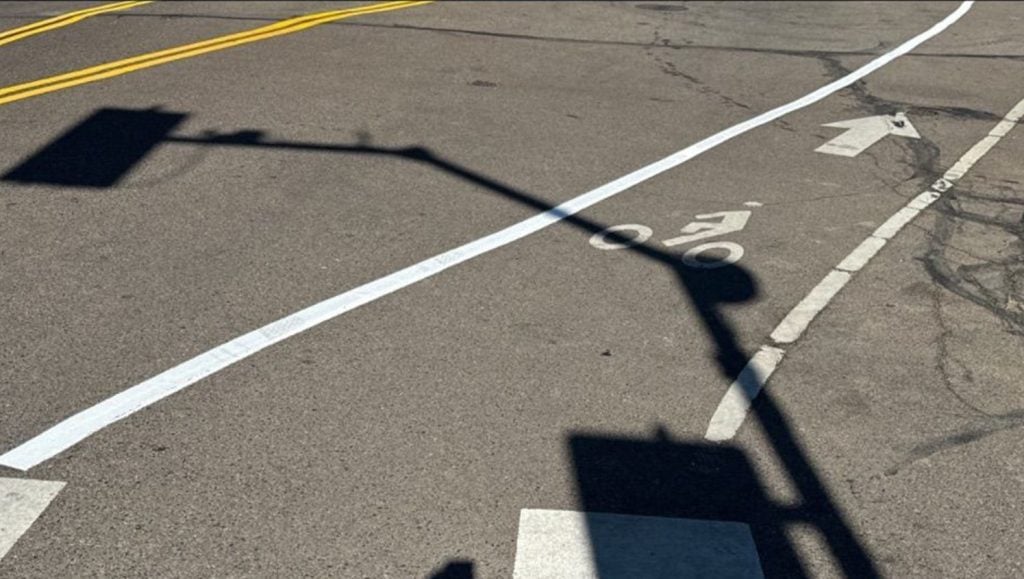 freshly painted double yellow line for Folsom Field