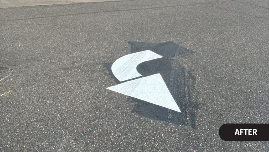 freshly painted white arrow for Trader Joe's
