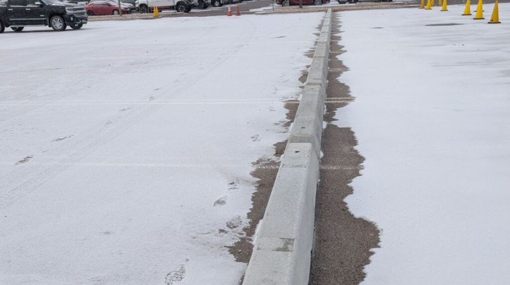 Curbo Curbs parking lot with stops installed close-up