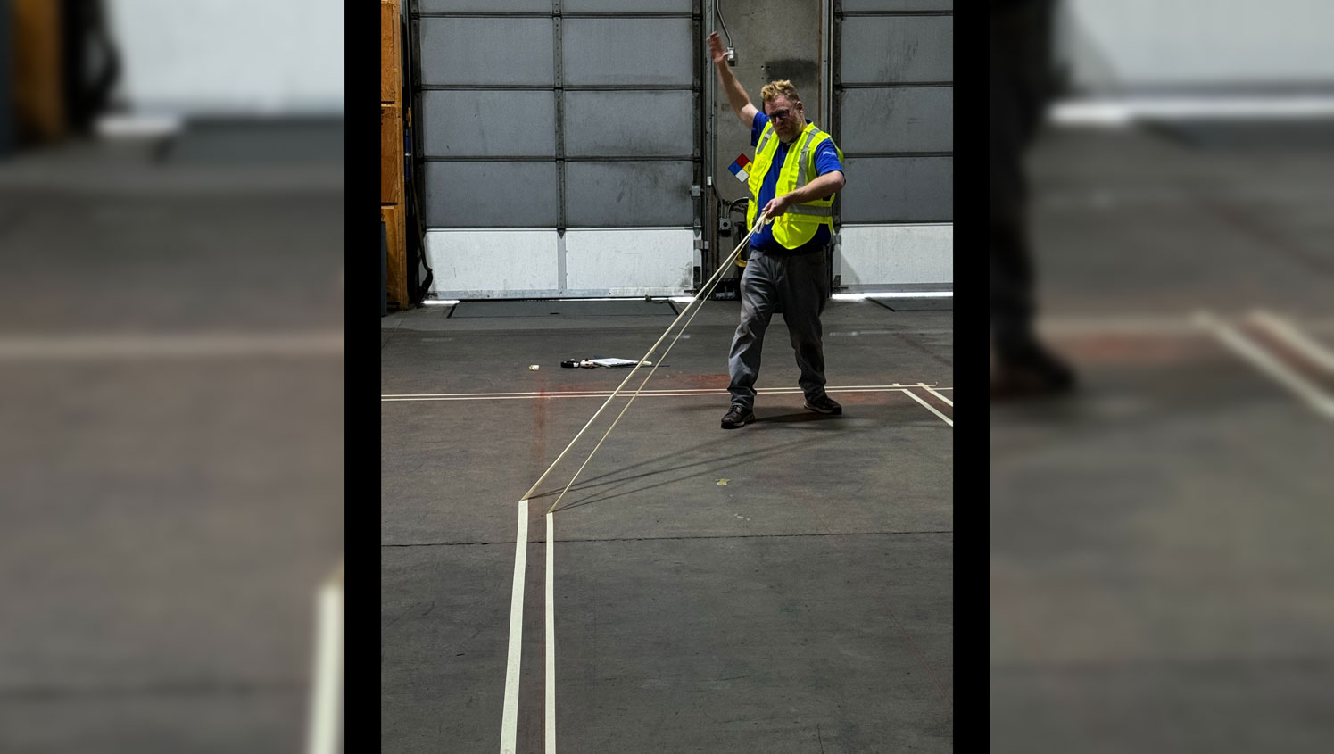 a close view of a G-FORCE employee marking a warehouse