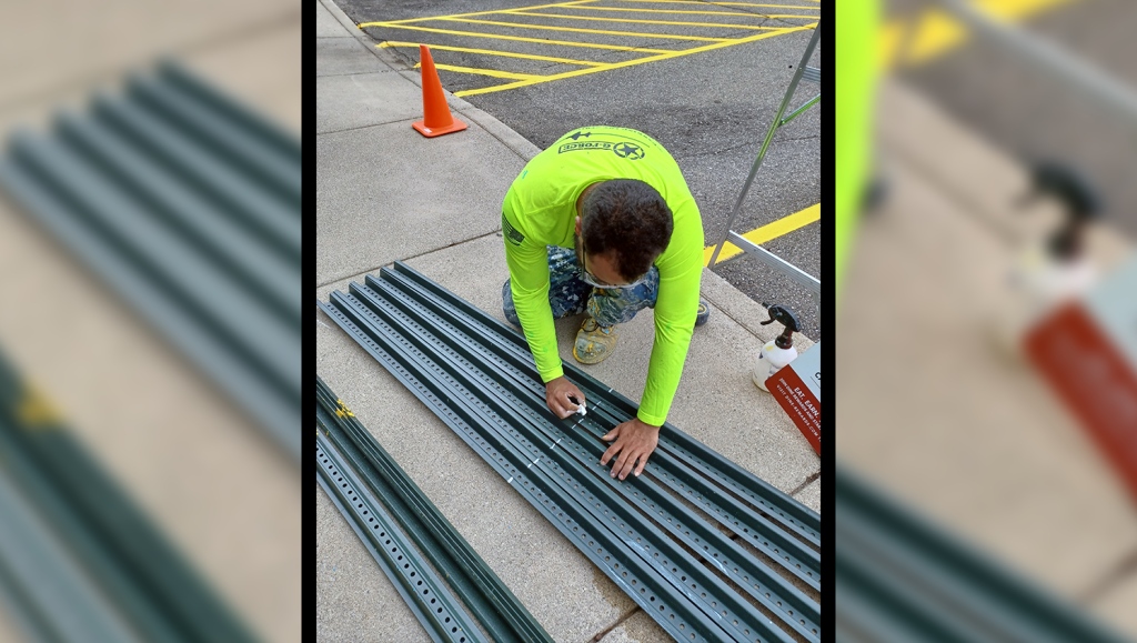 g-force team member working on signage