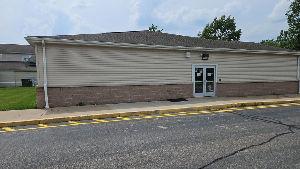 side view of Taylor Exemplar Academy with freshly painted curb painting markings
