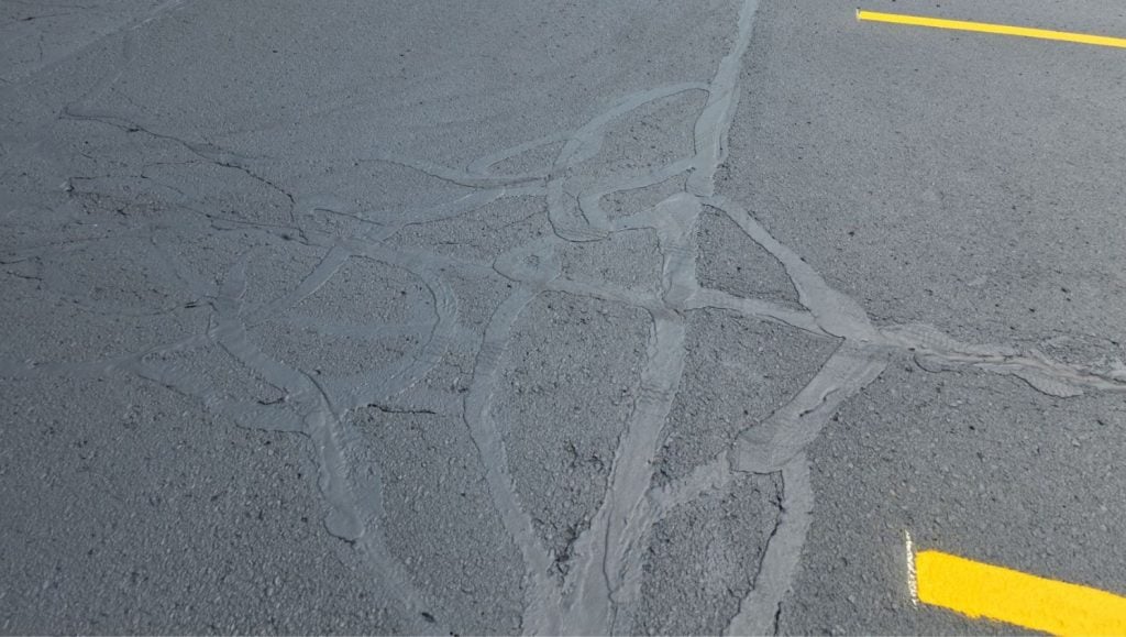 crack sealing close up for credit union parking lot