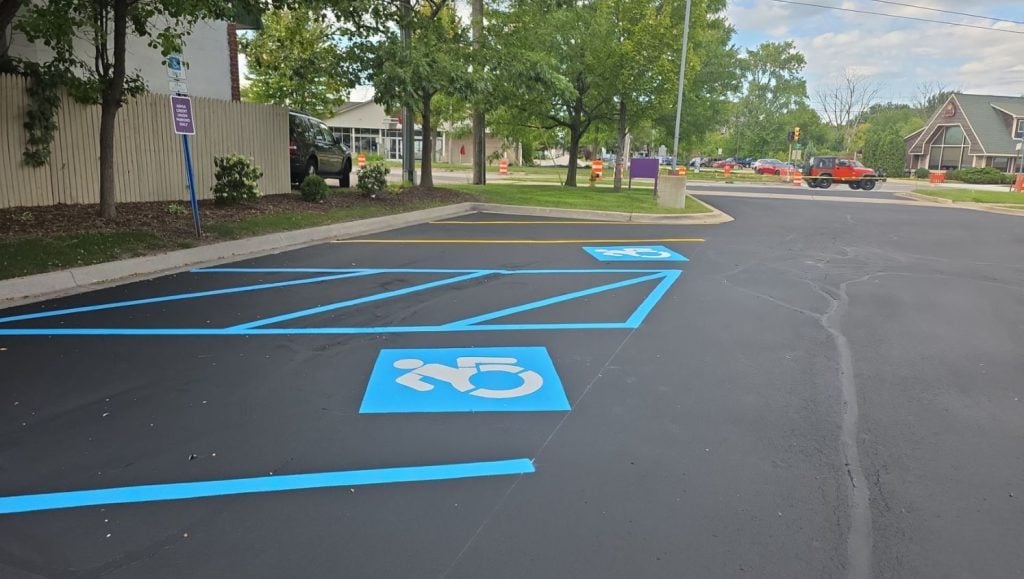 close-up of ada compliance parking spots freshly painted for Advia Credit Union
