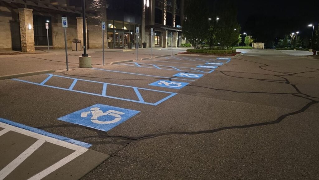 close-up of ada compliance parking spots freshly painted for Lifetime Fitness