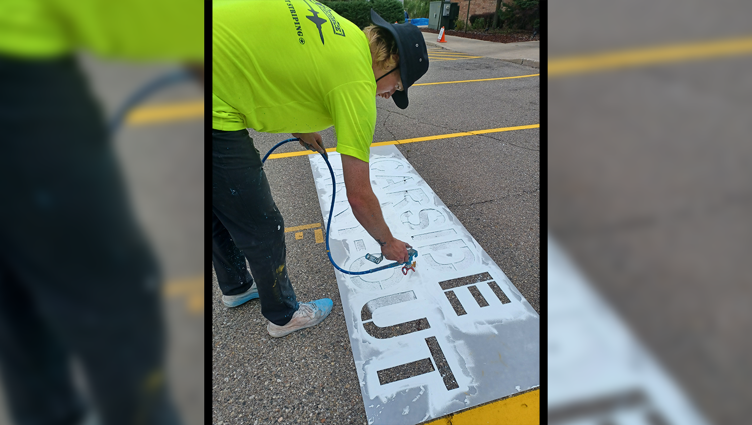 worker painting with custom stencils