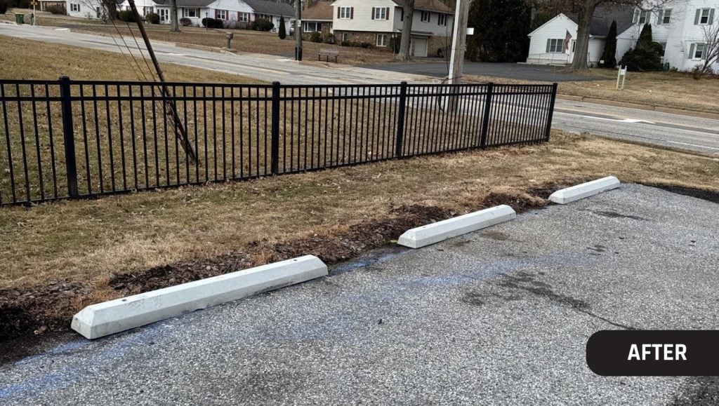 parking lot with new parking stops installed