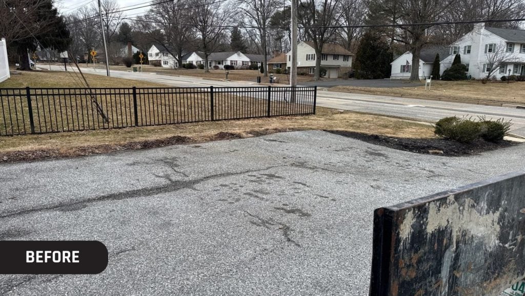 office building parking lot with no parking stops