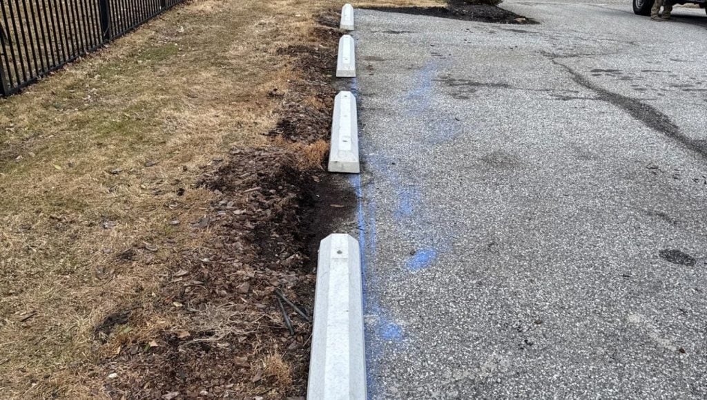 close-up of parking stops installed for office building