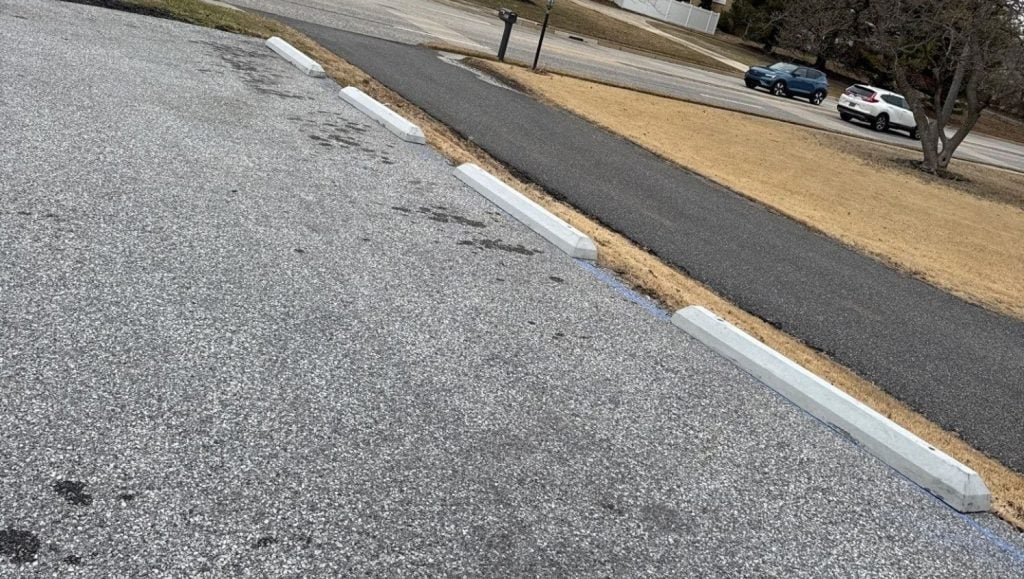 parking stops installed for office building parking lot