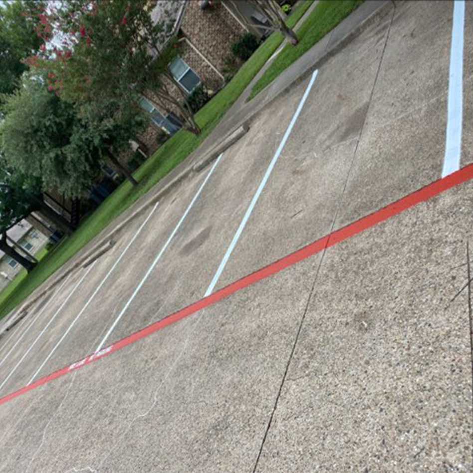 view of freshly painted parking stalls at Red Oak Apartments