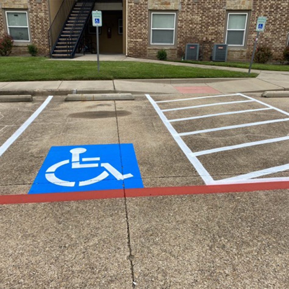 front view of newly marked handicap space at Red Oak Apartments