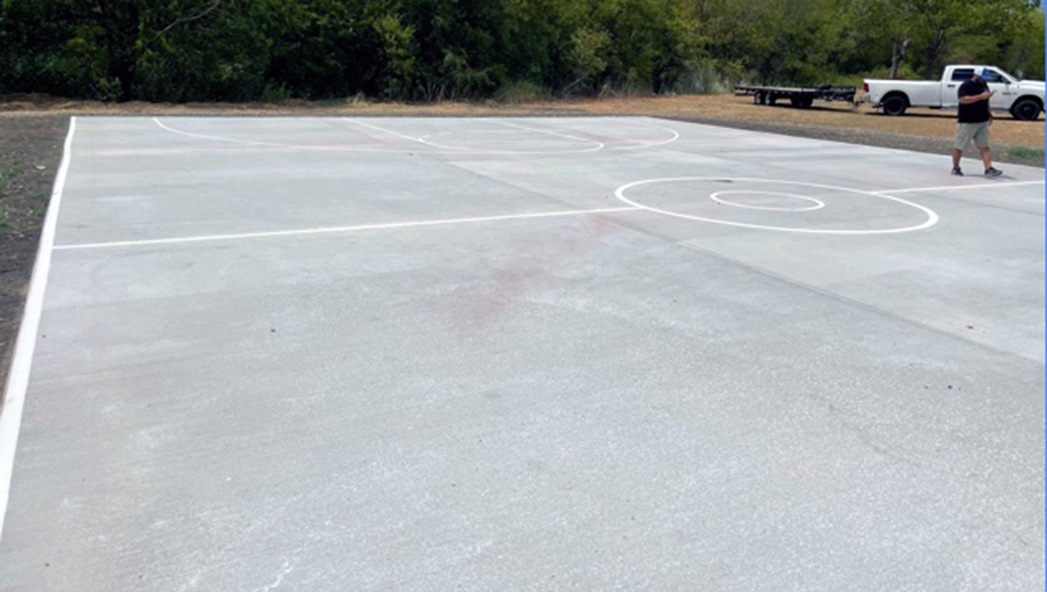 basketball court being prepped for re-striping
