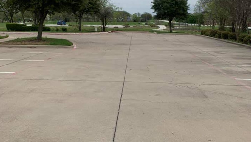 faded parking lot stripes and fire lanes