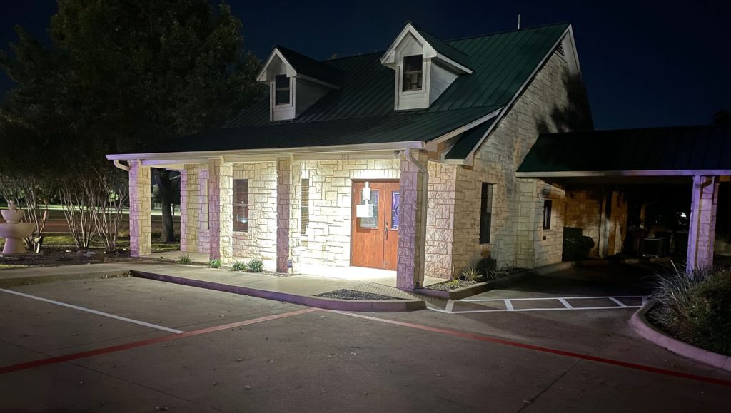 front view of business with freshly painted parking spots