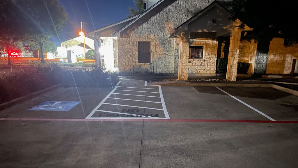 parking spots freshly painted for 4 Separate Small Businesses