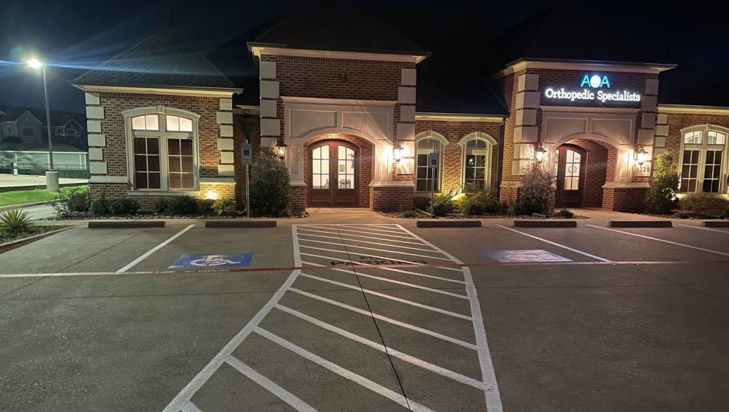 front view of 4 Separate Small Businesses with freshly painted parking spots