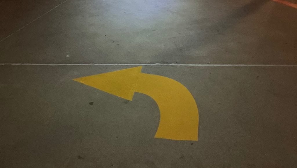 freshly painted yellow arrow for CVS parking lot