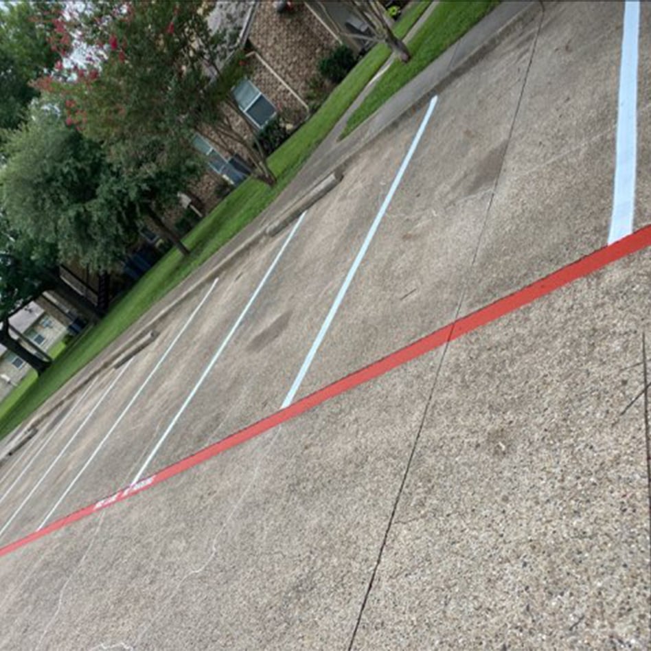 side view of freshly painted parking lot at Red Oak Apartments